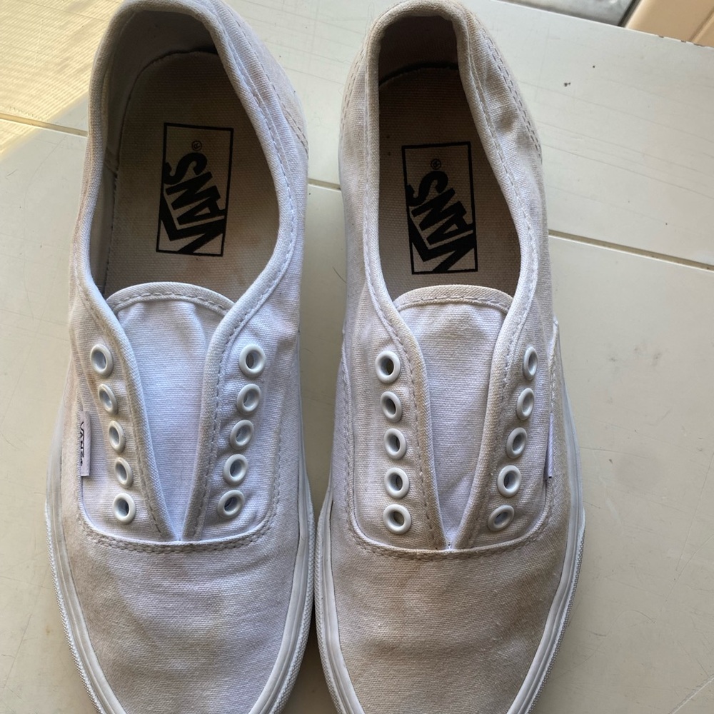 Coffee stainedWhite Vans slip-on trainers clean but stained
